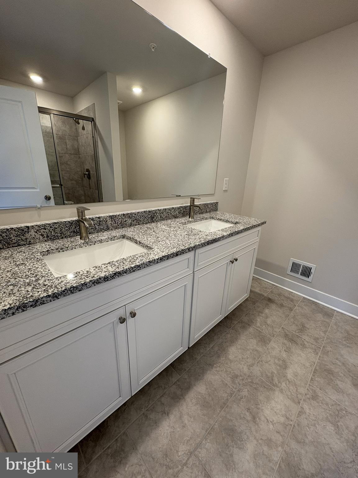 7450 Cornerstone Way Laurel, MD 20707 - Photo 9 of 14 a bathroom with a granite countertop sink and a mirror