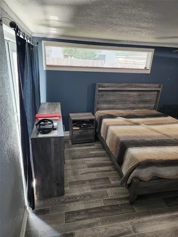 a bedroom with a bed and a mirror