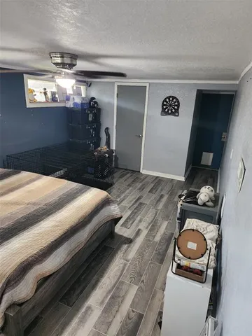 a bedroom with a bed and a tv