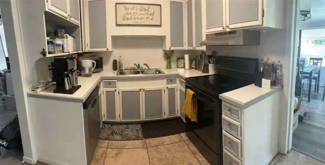 a kitchen with a stove and a refrigerator
