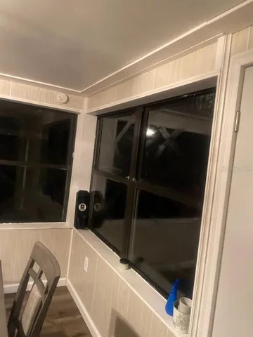 a bedroom with a bed and a mirror