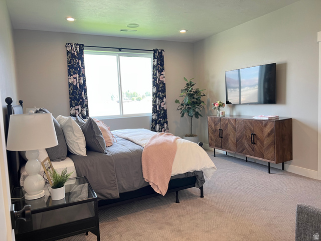 1951 2900 West Provo, UT 84601 - Photo 13 of 21 Carpeted room featuring a large window with white trim, recessed lighting, and light-colored walls