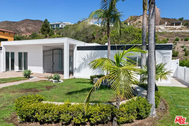 a view of empty room with a fireplace