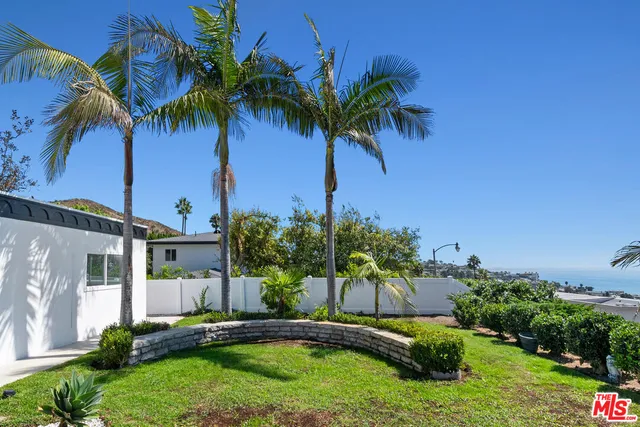 a view of a room with a large window and table
