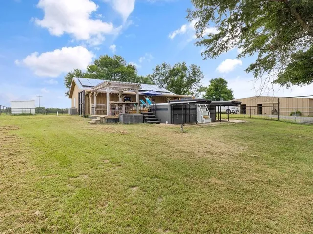 a aerial view of a house with a yard