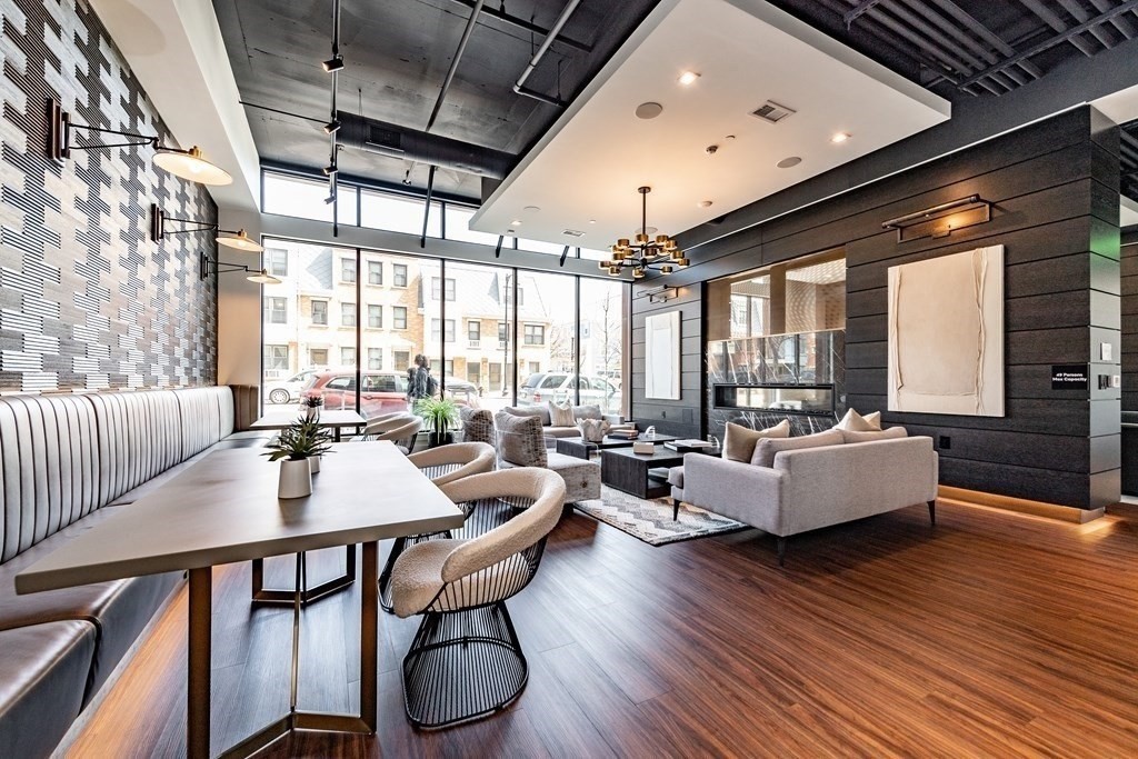 99 Sumner Street, Unit 413 Boston, MA 02128 - Photo 11 of 17 a living room with furniture and a large window
