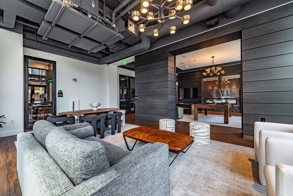 99 Sumner Street, Unit 413 Boston, MA 02128 - Photo 12 of 17 a living room with furniture and a fireplace