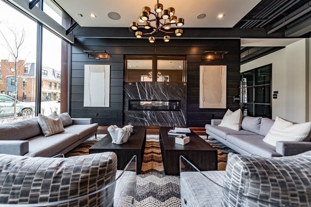 99 Sumner Street, Unit 413 Boston, MA 02128 - Photo 7 of 17 a living room with furniture and a large window