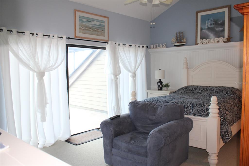335 Windrush Loop, Unit 335 Tarpon Springs, FL 34689 - Photo 8 of 18 a living room with furniture and a window