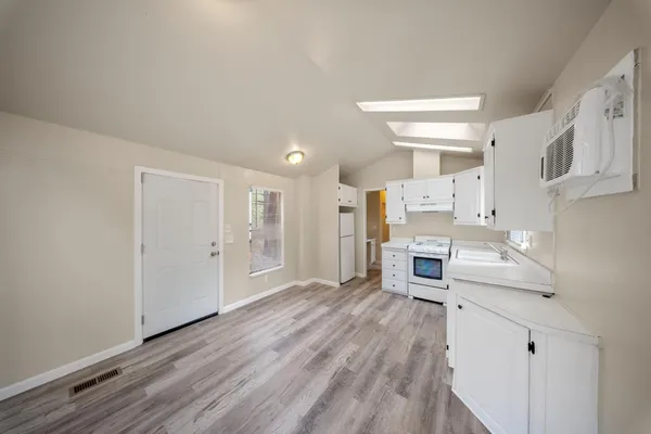 a view of kitchen with wooden floor
