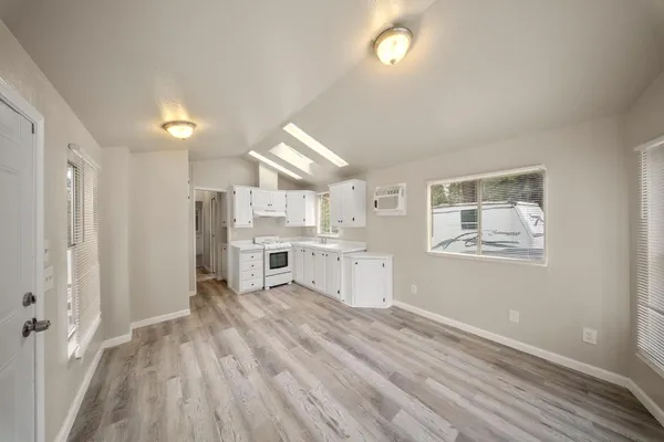 a view of kitchen with wooden floor