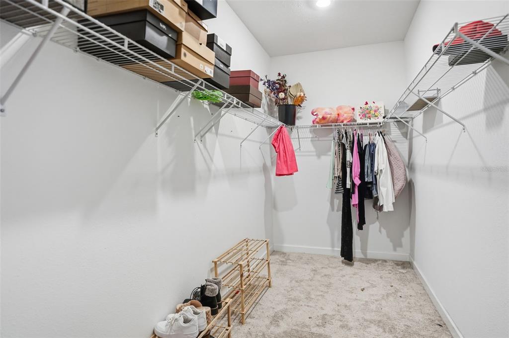 8676 Capstone Ranch Drive New Port Richey, FL 34655 - Photo 27 of 47 a view of walk in closet with clothes