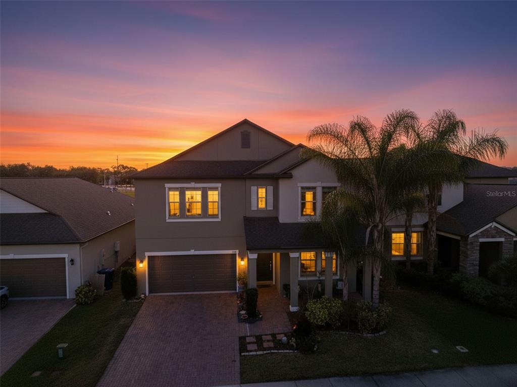 8676 Capstone Ranch Drive New Port Richey, FL 34655 - Photo 3 of 47 a front view of a house with a yard
