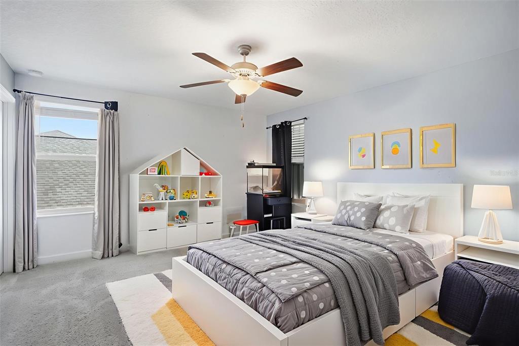 8676 Capstone Ranch Drive New Port Richey, FL 34655 - Photo 32 of 47 a bedroom with a bed and a large window