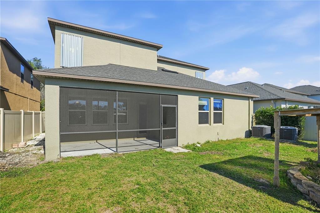 8676 Capstone Ranch Drive New Port Richey, FL 34655 - Photo 40 of 47 a view of a house with backyard