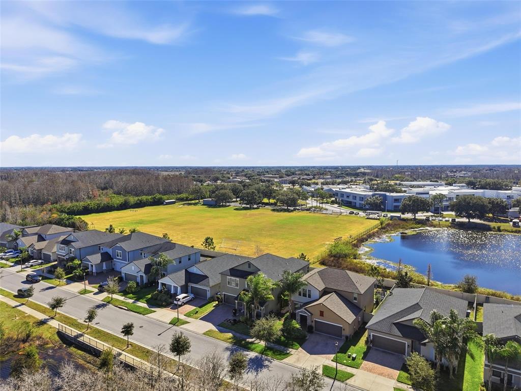 8676 Capstone Ranch Drive New Port Richey, FL 34655 - Photo 47 of 47 an aerial view of residential houses with outdoor space and swimming pool