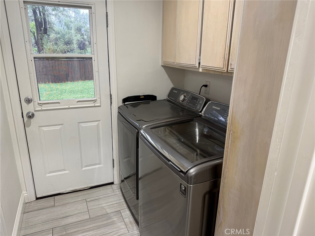 1530 Robin Way Fullerton, CA 92835 - Photo 13 of 35 a utility room with wooden floor washer and dryer