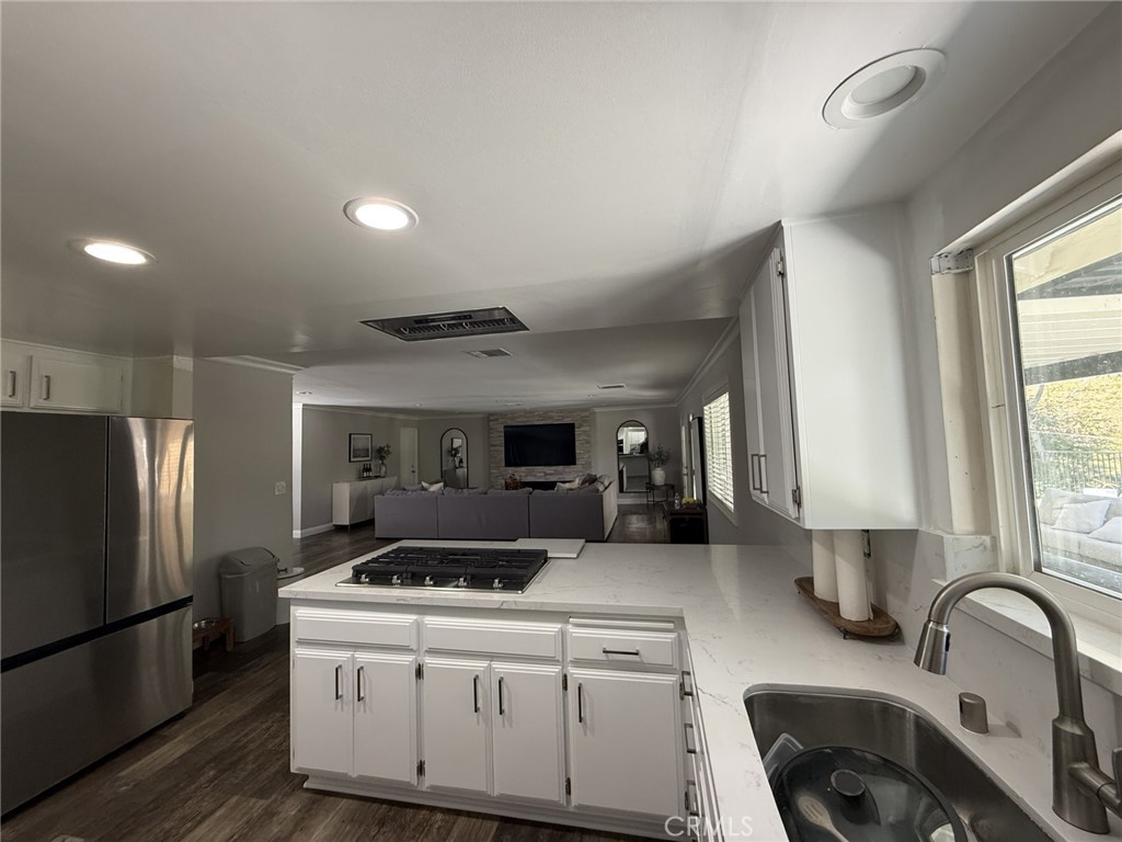 1530 Robin Way Fullerton, CA 92835 - Photo 21 of 35 a kitchen with a sink cabinets and stainless steel appliances