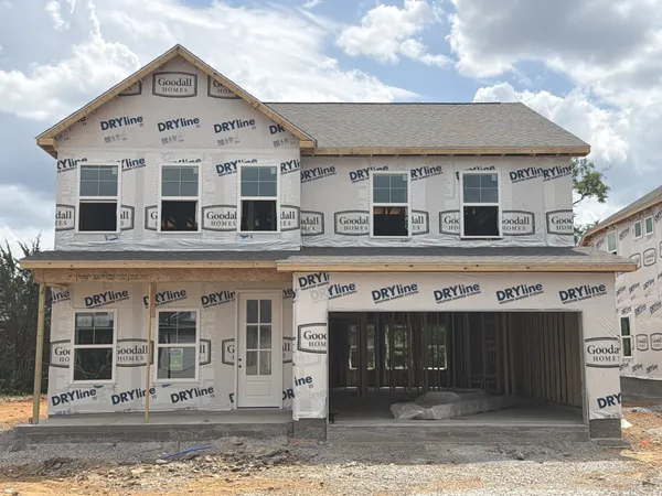 a black and white photo of a living room