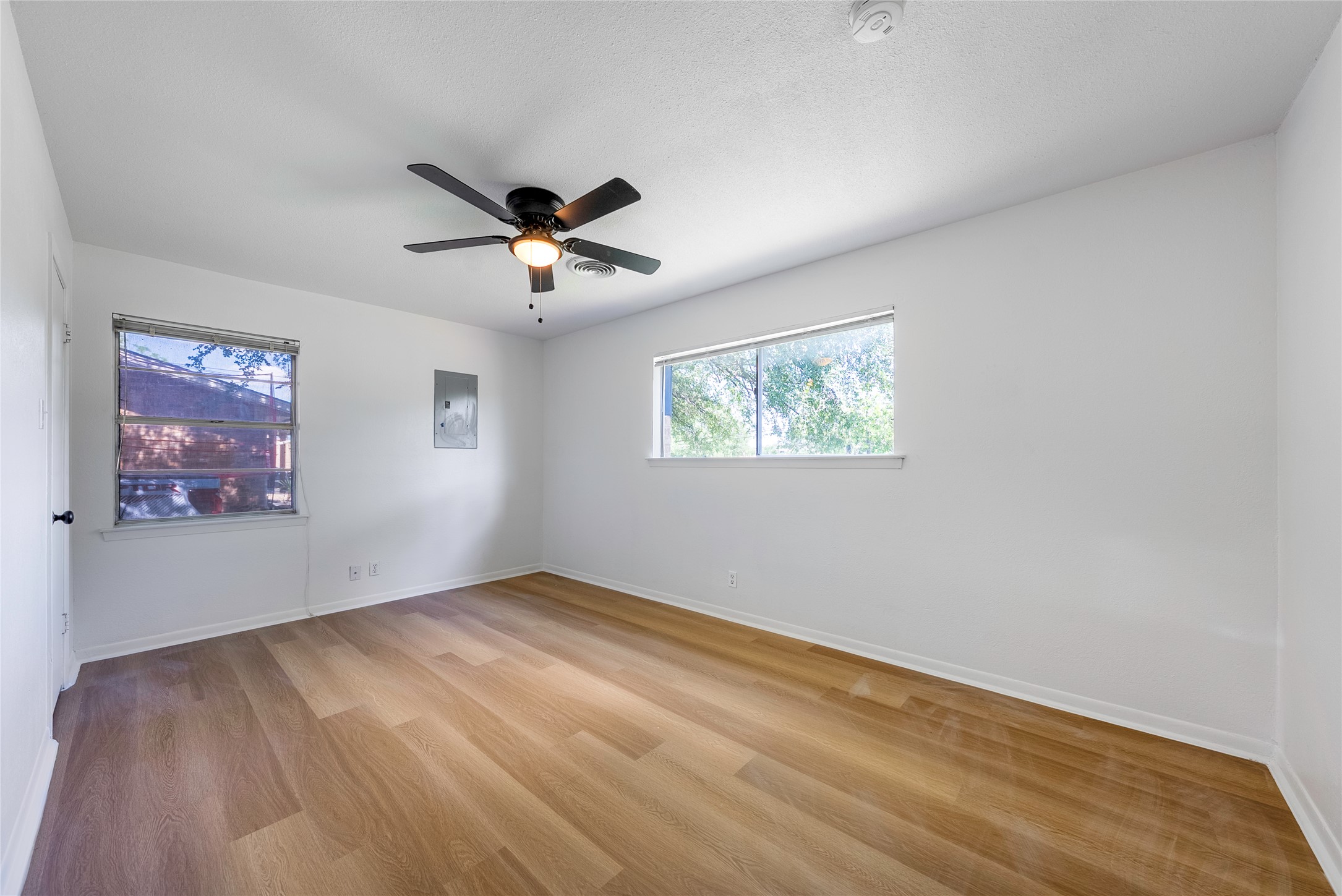 807 Country Club Road Georgetown, TX 78628 - Photo 18 of 28 a view of empty room with wooden floor