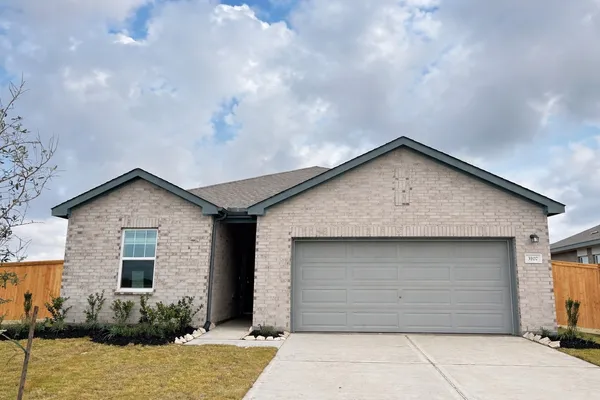 a front view of a house with a garage