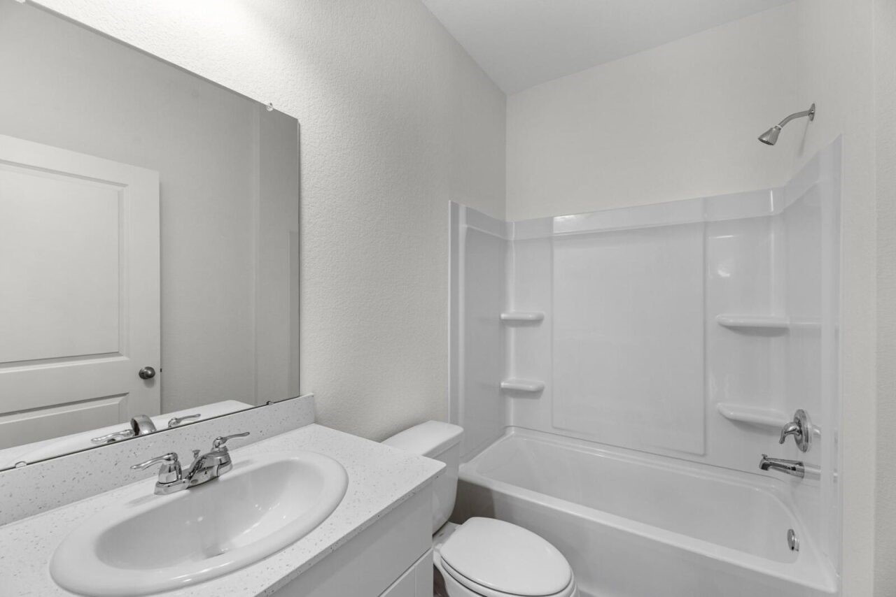 3107 Diamond Vw Lane Angleton, TX 77515 - Photo 12 of 14 a bathroom with a bathtub shower sink and toilet