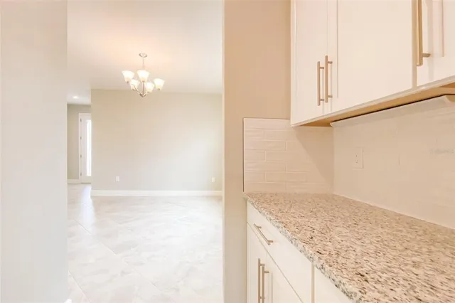 a view of a kitchen with a sink and windows