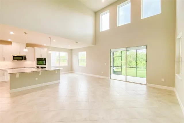a view of a kitchen with furniture and a window