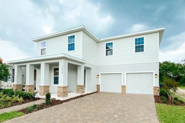 a view of a house with a yard and plants