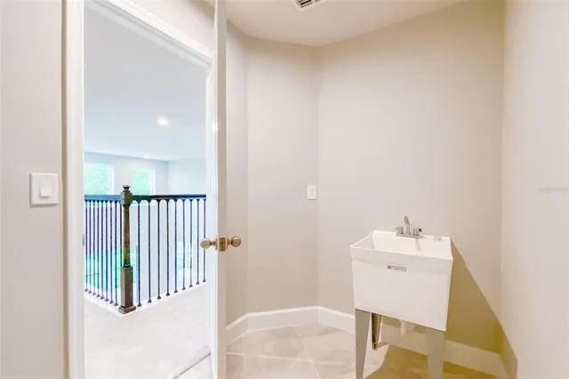 a bathroom with a bathtub shower sink and a mirror