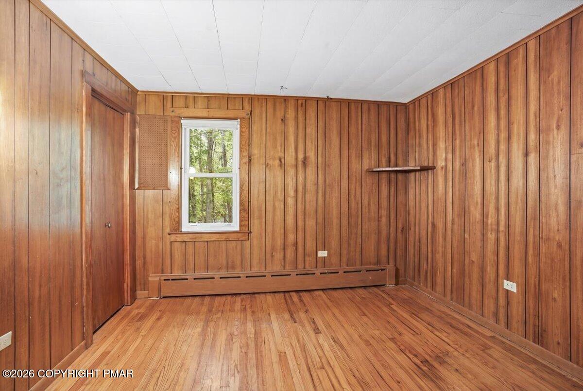 232 Garrity Road Hawley, PA 18428 - Photo 33 of 57 a view of an empty room with wooden floor and a window