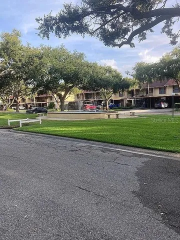 a view of outdoor space with yard and green space