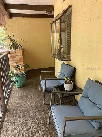 a outdoor living space with furniture and a potted plant