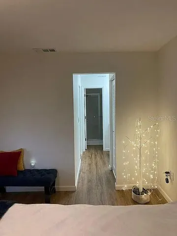 a living room with furniture and a lamp