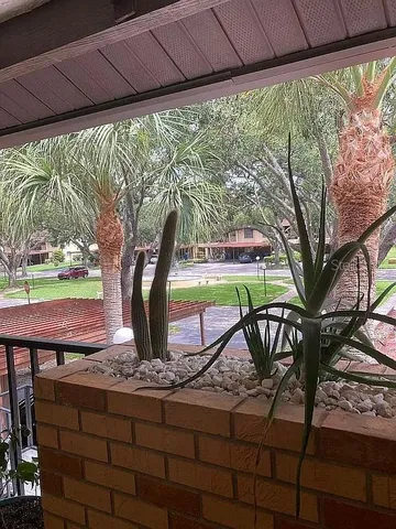 a view of a backyard with a sitting area
