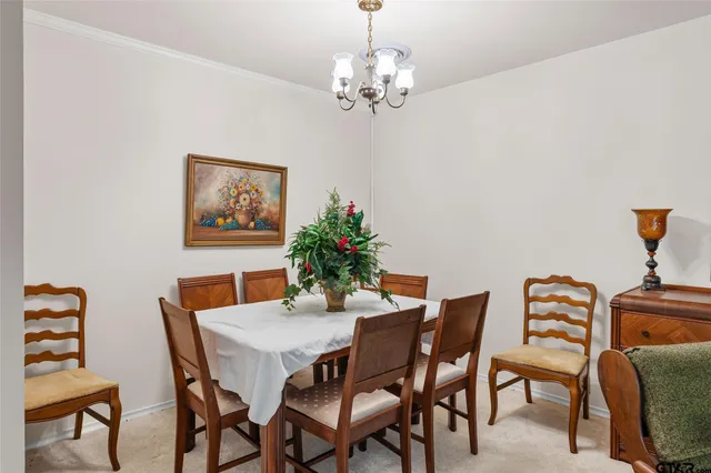 a bedroom with two beds and a window
