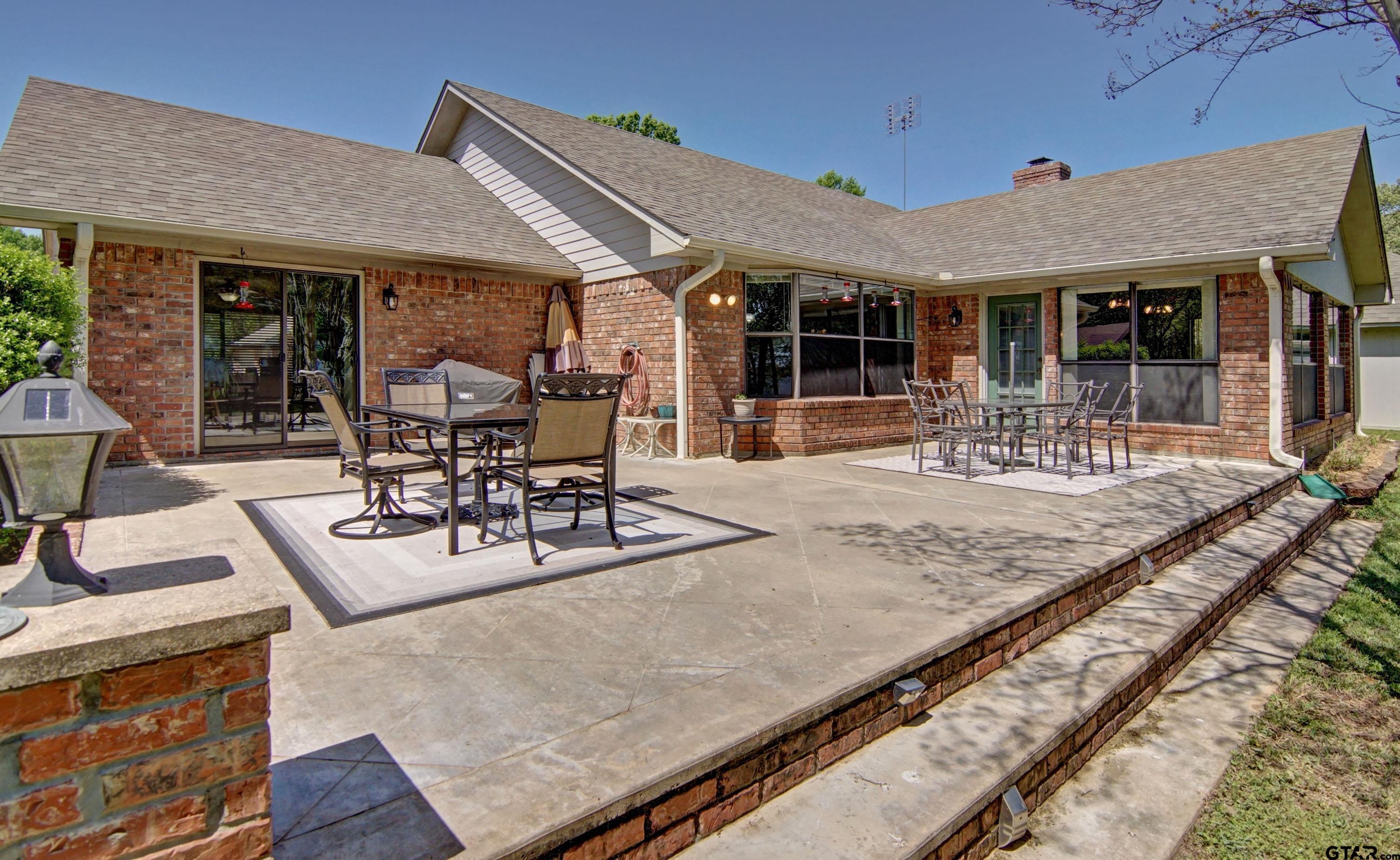 227 Private Road 5885 Yantis, TX 75497 - Photo 15 of 41 a view of a patio with table and chairs and wooden floor