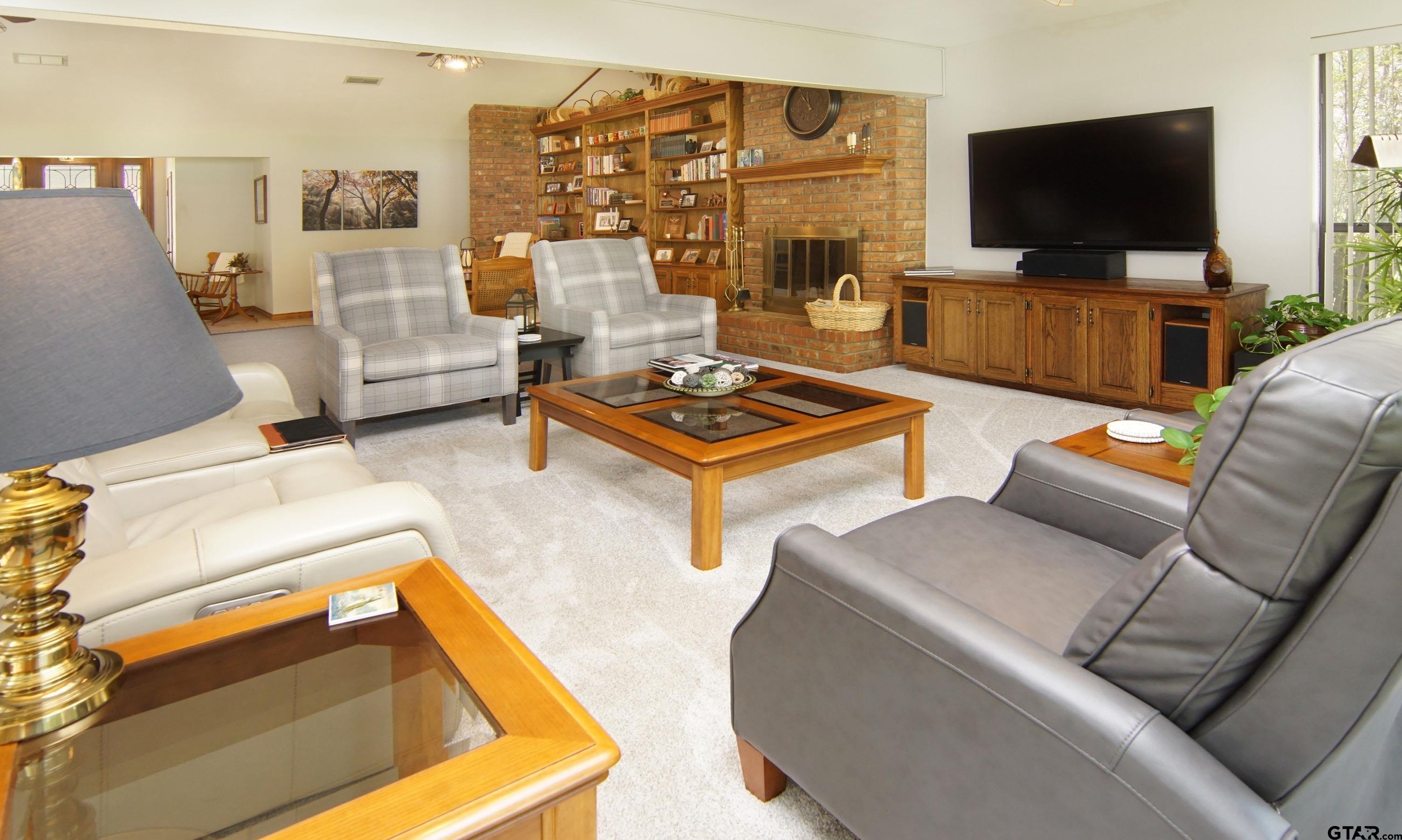 227 Private Road 5885 Yantis, TX 75497 - Photo 2 of 41 a living room with furniture and a flat screen tv