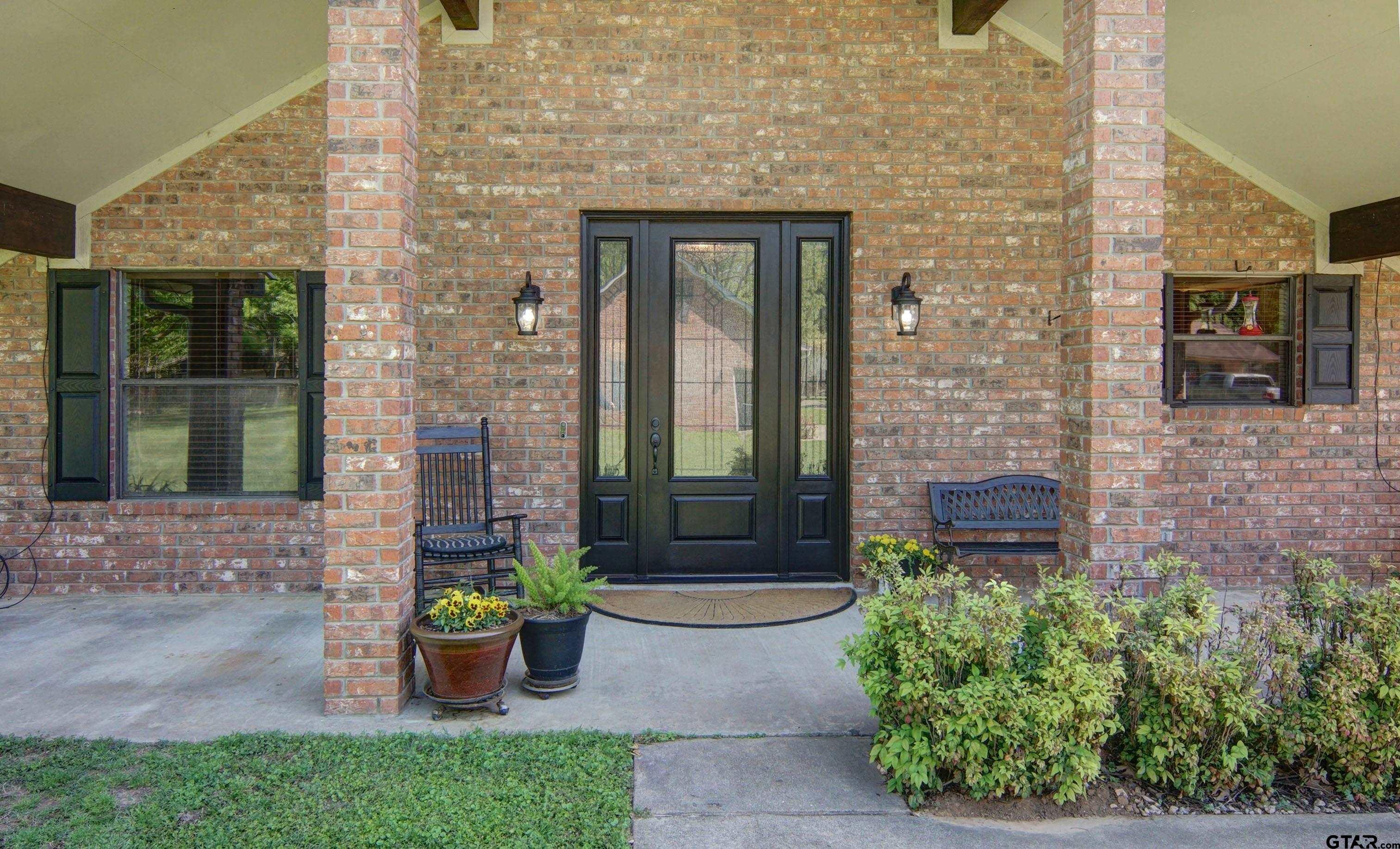 227 Private Road 5885 Yantis, TX 75497 - Photo 36 of 41 a front view of a house with a garden