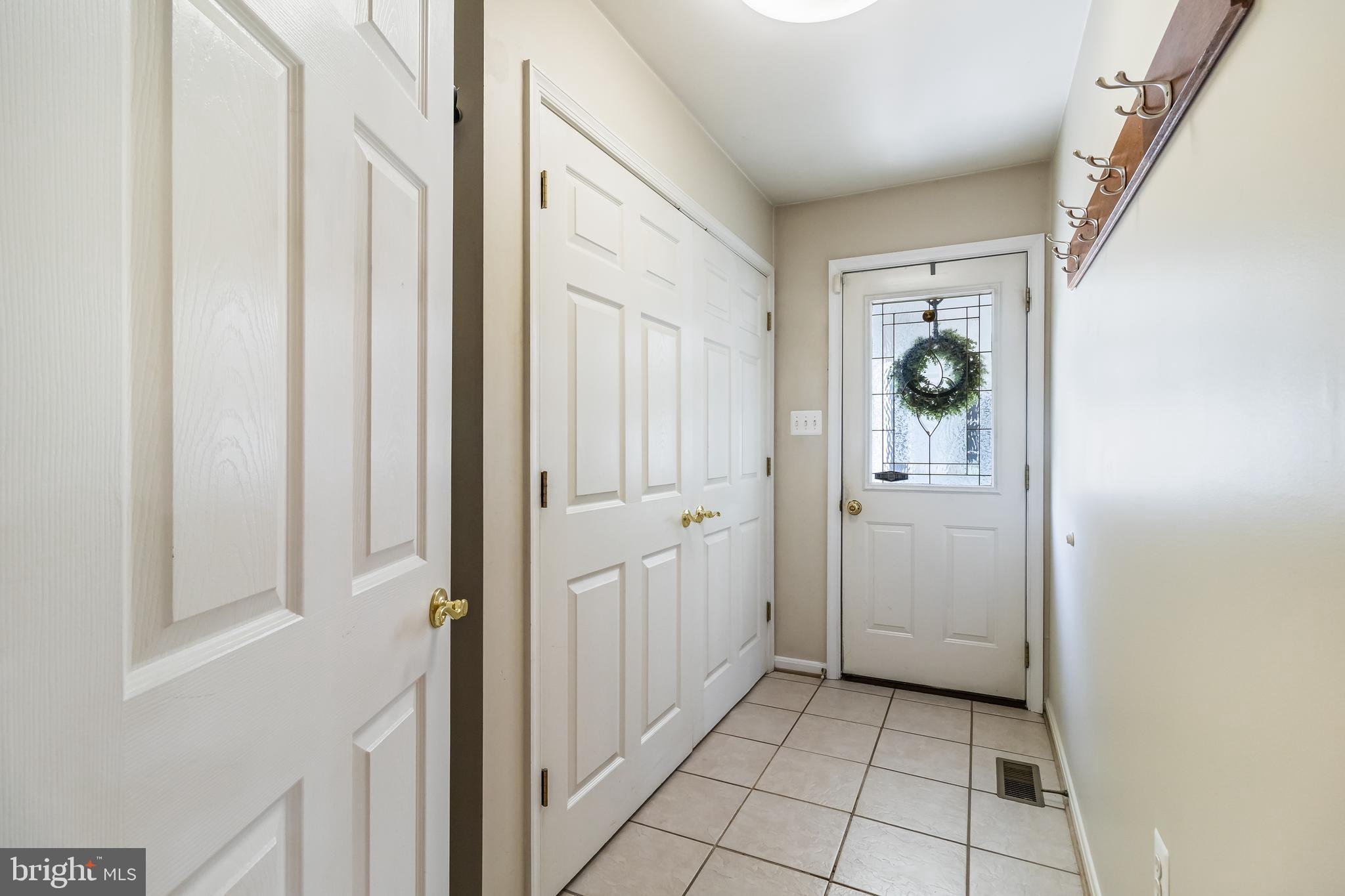 203 Morgans Ridge Court La Plata, MD 20646 - Photo 10 of 59 a view of a hallway with bathroom and wooden floor
