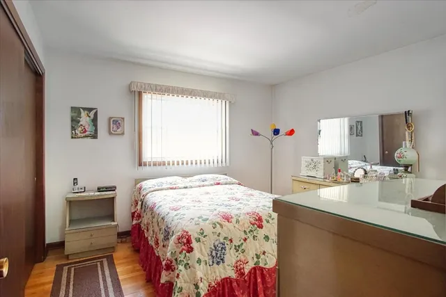 a bedroom with a bed and a dresser