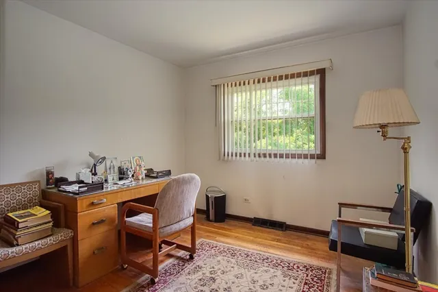 a workspace with furniture and window