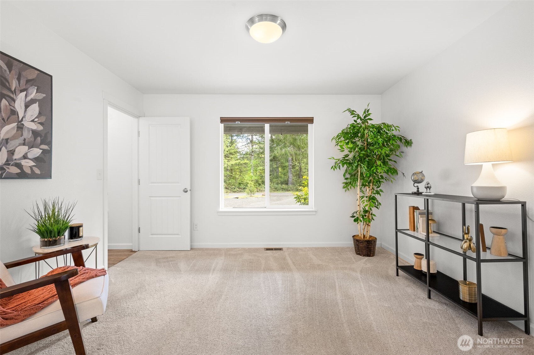 401 East Sunset Ridge Road Union, WA 98592 - Photo 12 of 37 a view of an empty room with window and a potted plant