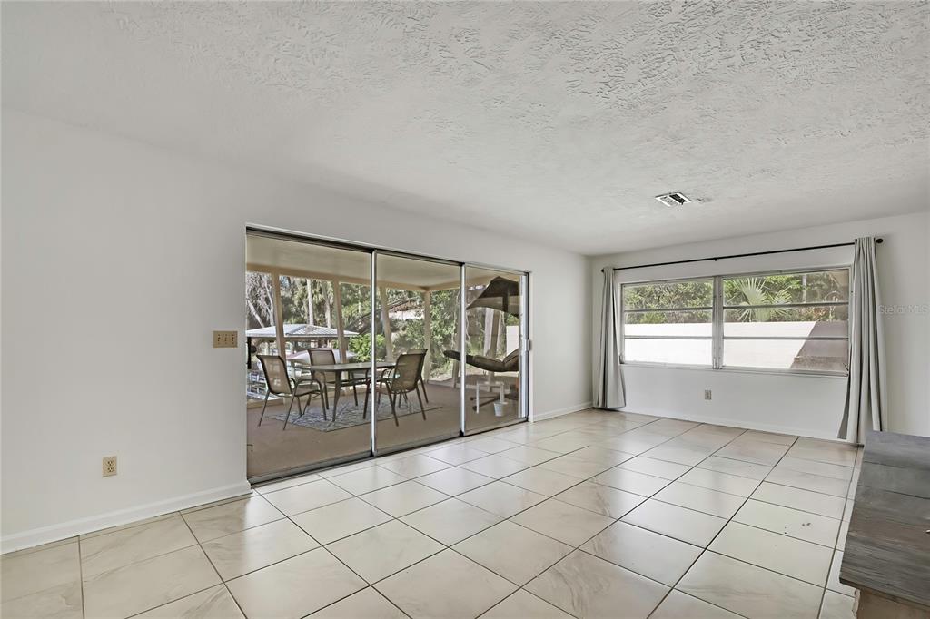 12130 Maple Street Dunnellon, FL 34432 - Photo 18 of 54 a view of an empty room with window