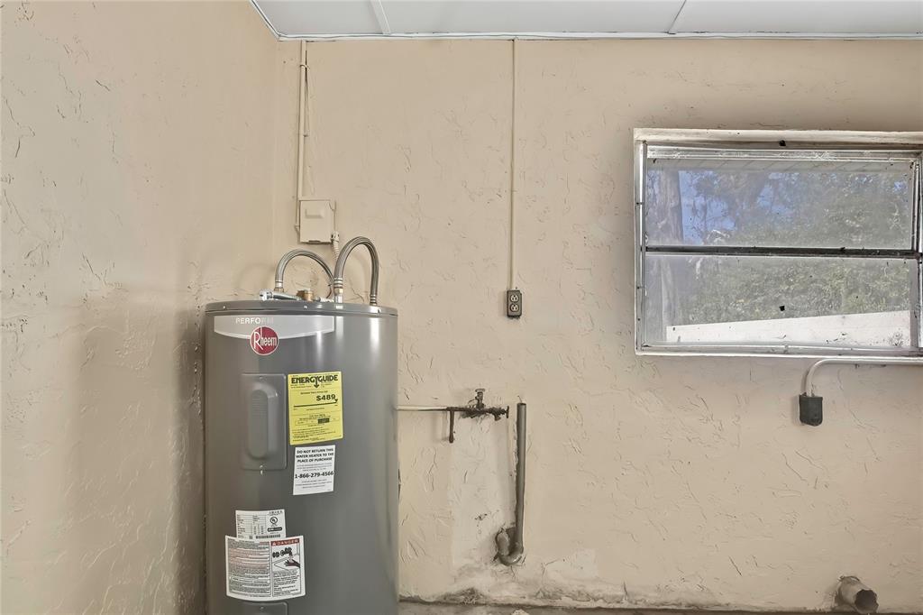 12130 Maple Street Dunnellon, FL 34432 - Photo 2 of 54 a bathroom with a sink and a mirror