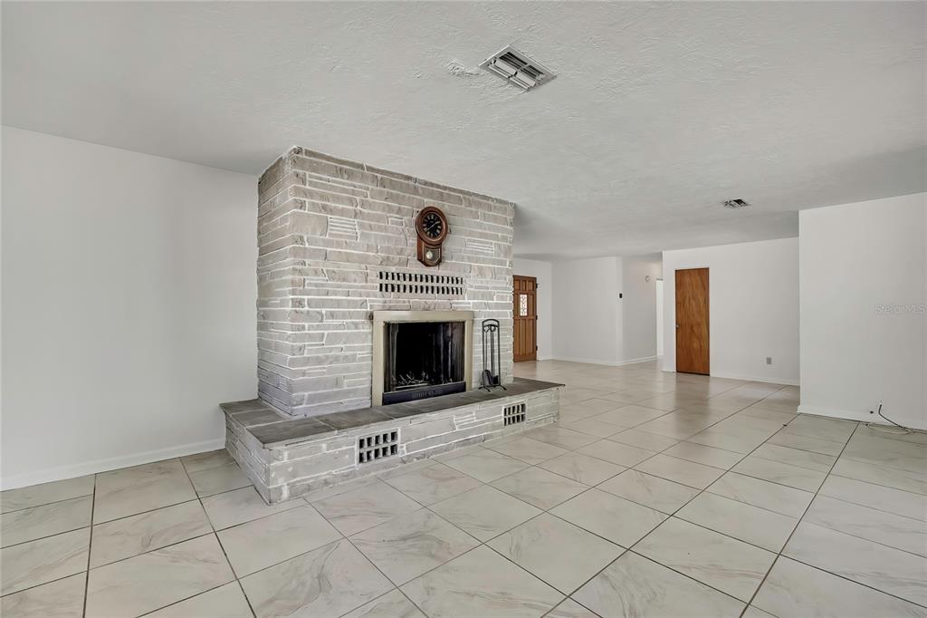 12130 Maple Street Dunnellon, FL 34432 - Photo 21 of 54 a view of a livingroom with a fireplace