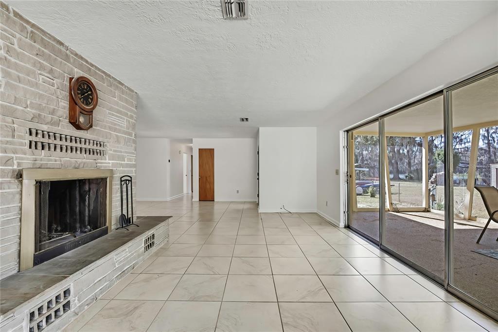 12130 Maple Street Dunnellon, FL 34432 - Photo 22 of 54 a view of an empty room with glass door