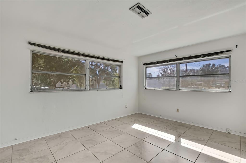 12130 Maple Street Dunnellon, FL 34432 - Photo 24 of 54 a view of an empty room with a window