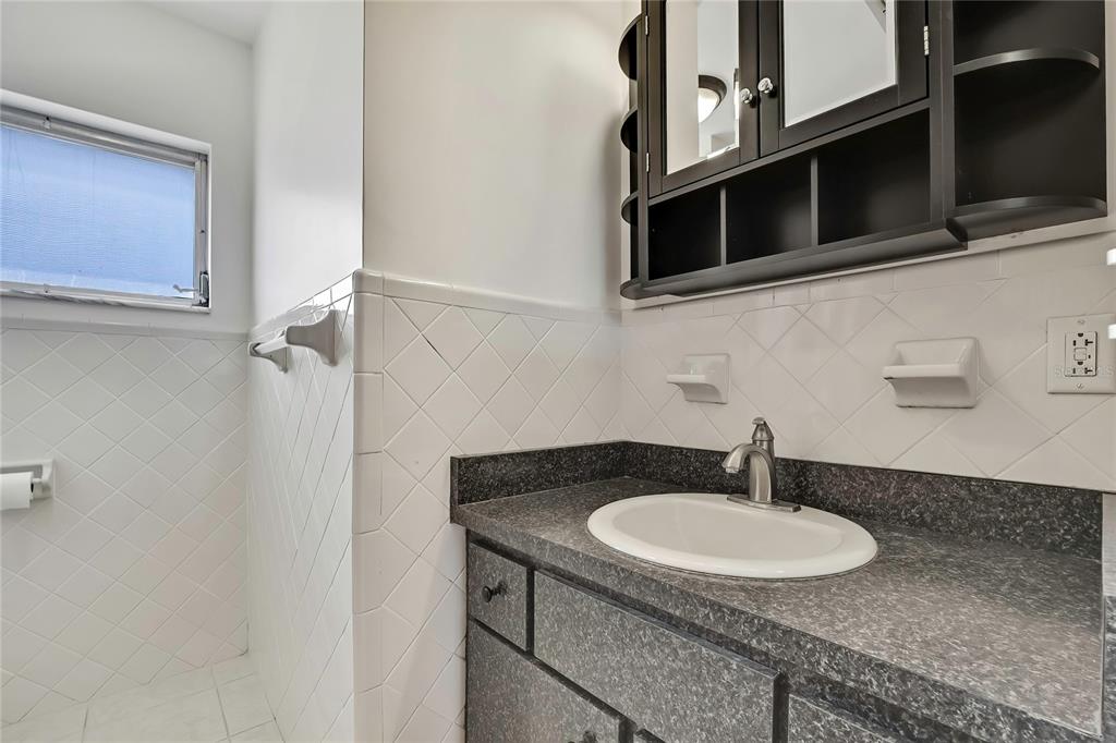 12130 Maple Street Dunnellon, FL 34432 - Photo 29 of 54 a bathroom with a sink and a mirror