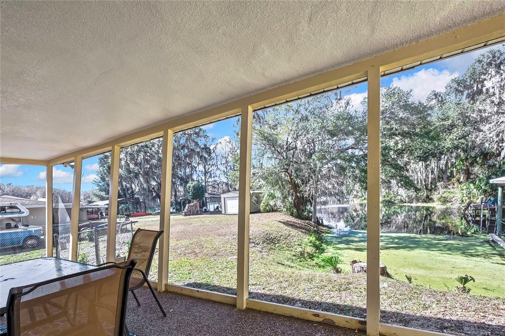 12130 Maple Street Dunnellon, FL 34432 - Photo 32 of 54 a view of backyard with large trees and plants